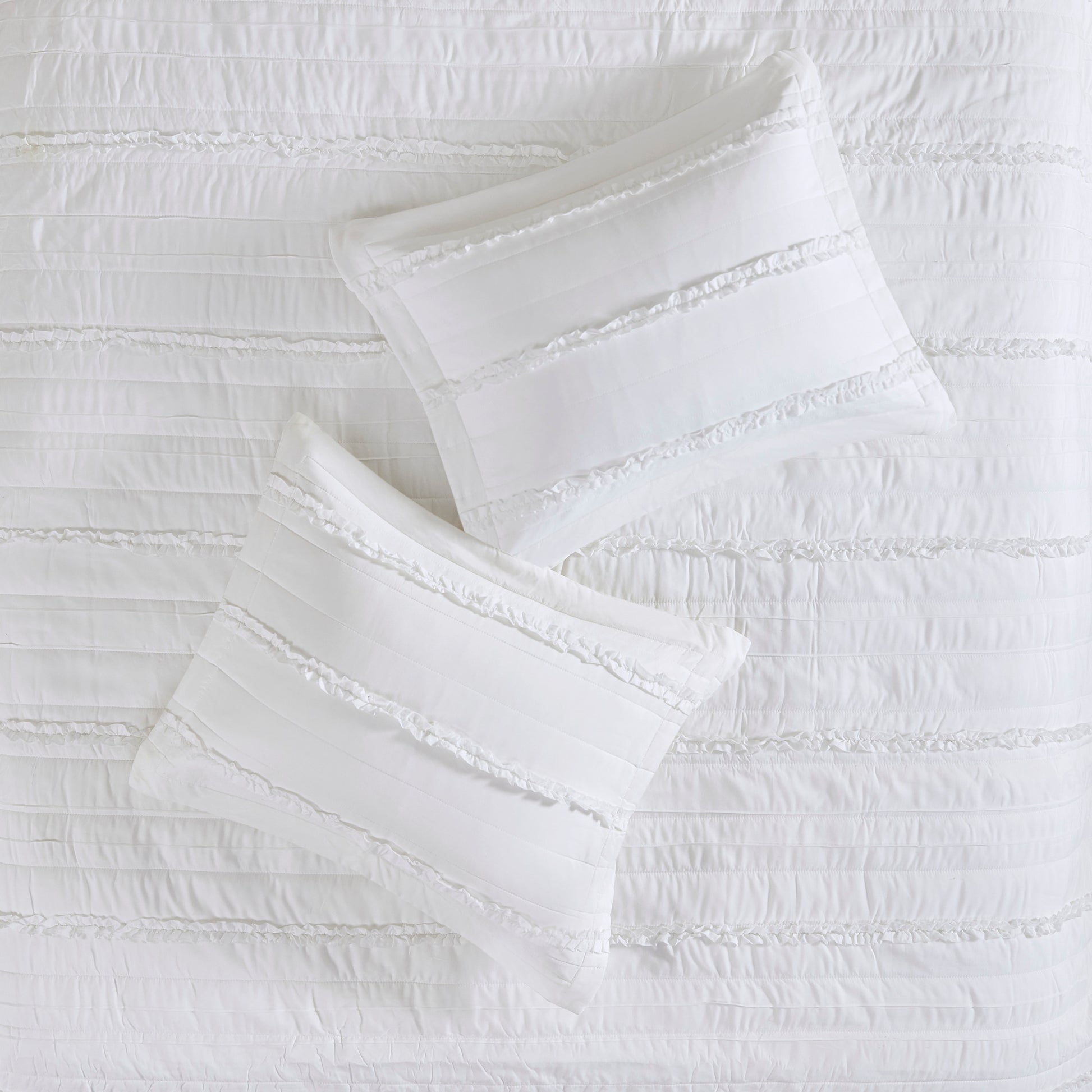 Madison Park 4 Piece Microfiber Reversible Ruffle Quilt Set with Throw Pillow