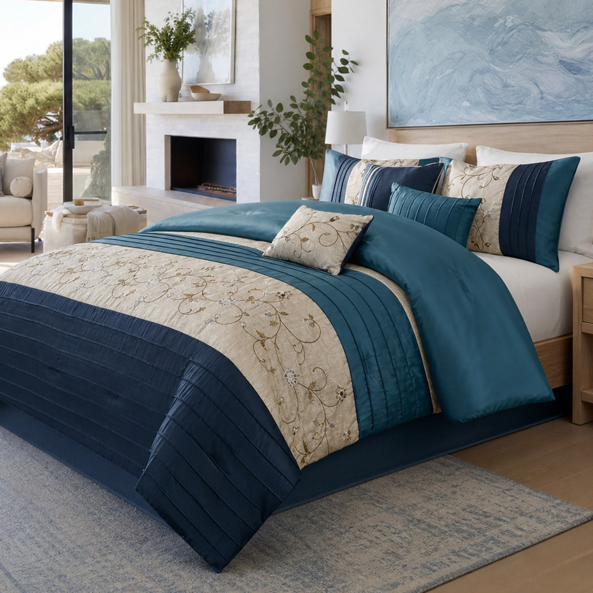 Serene Collection by Madison Park. Comforter set with floral embroidery, pleated faux silk accents, navy and teal colorway, styled on a bed. Links to Serene Collection page with matching bath and window products.